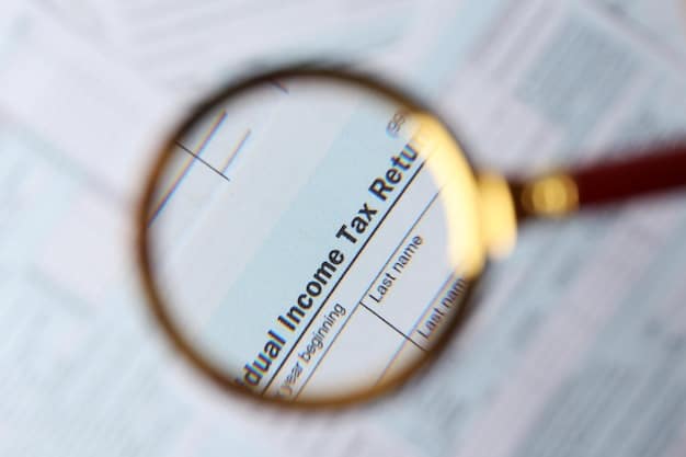A detailed close-up of a tax form being reviewed by a financial advisor, highlighting specific sections related to business deductions and credits. The composition is tight and technical, with a focus on numbers and legal jargon.