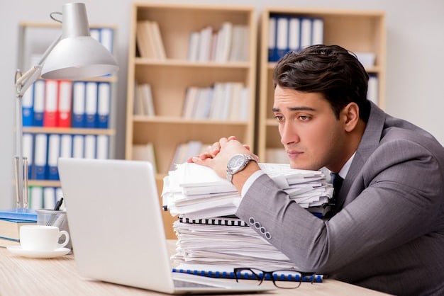 An entrepreneur in the US sitting at their desk, looking stressed and overwhelmed, surrounded by piles of paperwork and a laptop displaying numerous open tabs.